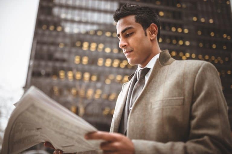 businessman reading newspaper