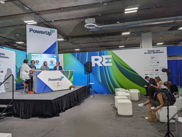 The PowerUp podcast recording live at RE+ with 4 speakers