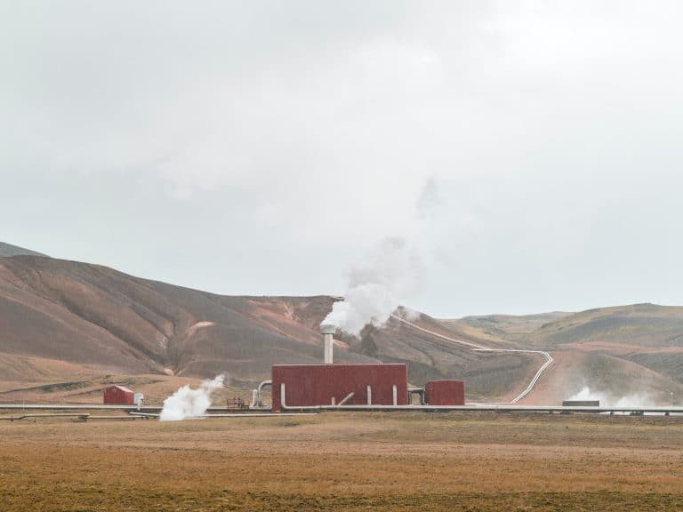 Geothermal power plant with mountains in the background