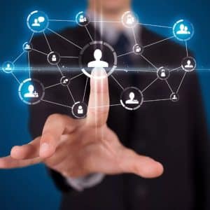 A businessman's finger touching digital person icons